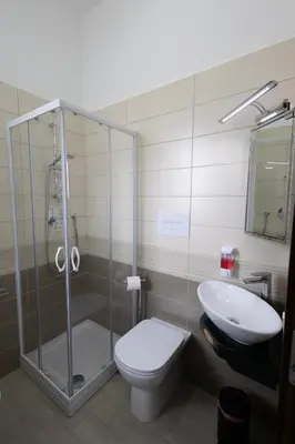 a bathroom with a shower and a toilet and a sink at PalerMonAmour Art Gallery Suite in Palermo