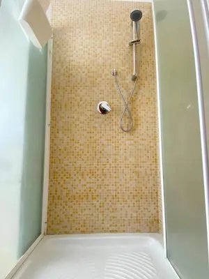 a shower with a shower head in a bathroom at casadifederica in Palermo