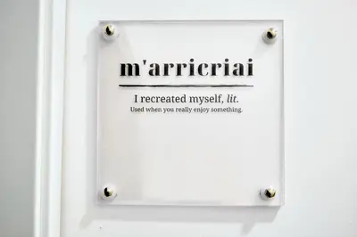 a sign on a door that reads imperialism at Mercede Rooms in Palermo