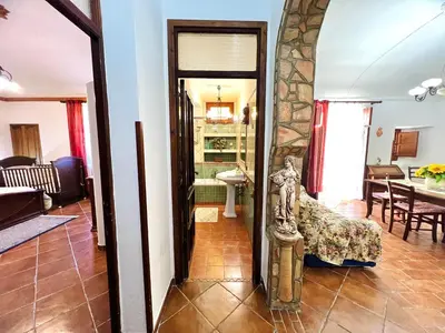 a living room with a statue of a woman at Nonna Sasà in Torretta