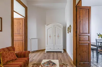 a living room with a couch and a door at GuestHost - Terry's Garden in Palermo in Palermo