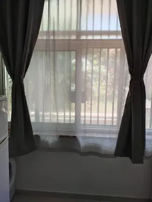 a window with black curtains and a window sill at Residence _Capo Gallo in Palermo
