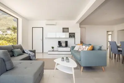 a living room with two couches and a table at Grande Villa privata con piscina a Scopello in Castellammare del Golfo