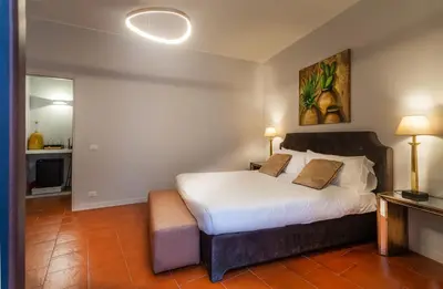 a bedroom with a large white bed in a room at Isula in Palermo
