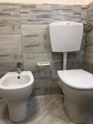 a bathroom with a toilet and a sink at A Petrazzi in Castellammare del Golfo