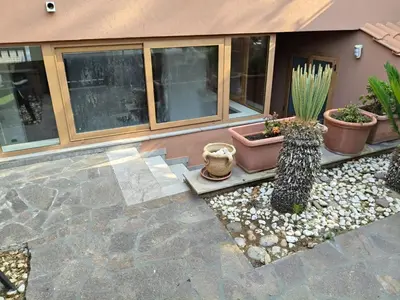 a group of cacti and plants in front of a building at Casabella Mondello in Mondello