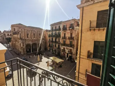 a view from a balcony of a city street at Dimora Lecerf in Palermo