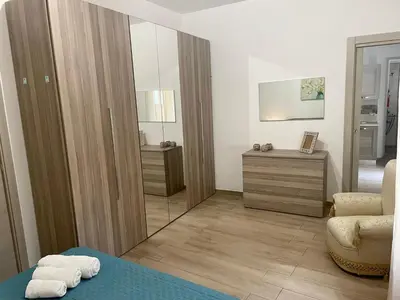 a bedroom with a bed with towels on it at Maqueda Apartament for 4 Palermo Centre Ballarò in Palermo