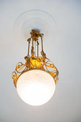 a chandelier hanging from a ceiling at AUSA suites in Palermo