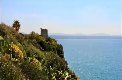 a castle on top of a hill next to the ocean at Katy's Holiday House, Private Villa and Pool in Terrasini