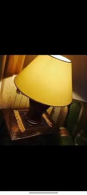 a lamp sitting on a table next to a couch at onoratocinque house apartment in Palermo