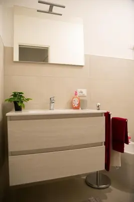 a bathroom with a sink and a mirror at Casa d'a-mare in Terrasini