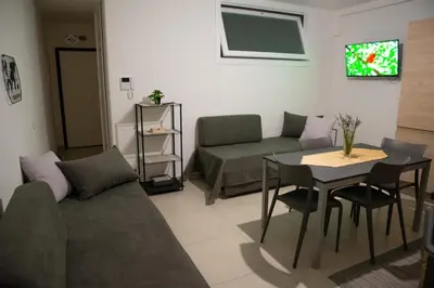 a living room with a couch and a table at Casa d'a-mare in Terrasini