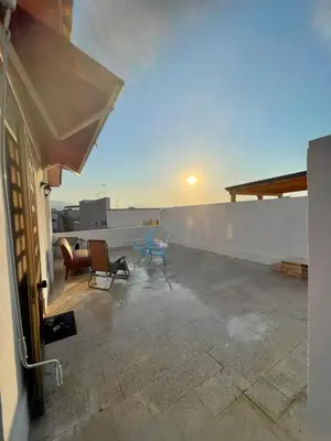 a patio with chairs and a table on a roof at Casa Scirocco in Balestrate