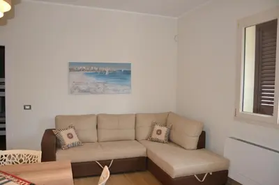 a living room with a couch and a window at Villa del Principe in Carini