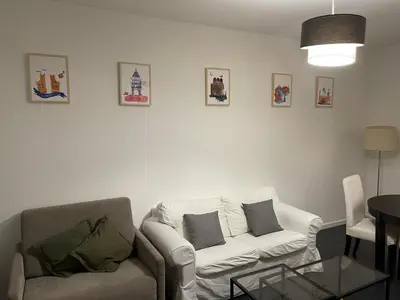 a living room with a couch and a table at Zanclea in Palermo