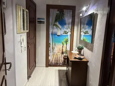 an open door with a view of the ocean at Casa Maria Costa Blu in Isola delle Femmine