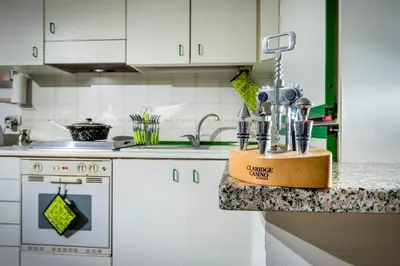 a kitchen counter with a block of kitchen utensils at Le Case di Katy in Castellammare del Golfo