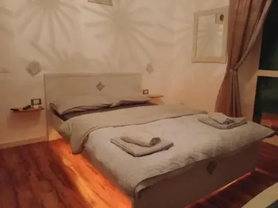 a bed with two towels on it in a room at Studio Sedie Volanti in Palermo