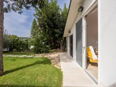 a side view of a house with a yard at Holiday Home Quirat by Interhome in Terrasini