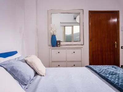 a bedroom with a bed with a mirror and a dresser at Apartment Casa dei Mori by Interhome in Terrasini