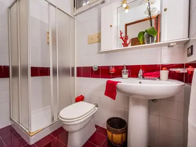 a bathroom with a toilet and a sink at Apartment Casa dei Mori by Interhome in Terrasini