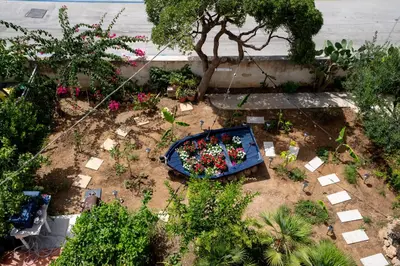 an overhead view of a garden with flowers and plants at B&B il Colibrì in San Vito lo Capo