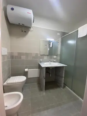 a bathroom with a toilet and a sink at 38 Aira Hotels in Palermo