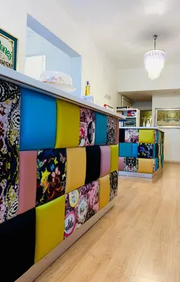 a room with colorful dividers in a store at 38 Aira Hotels in Palermo