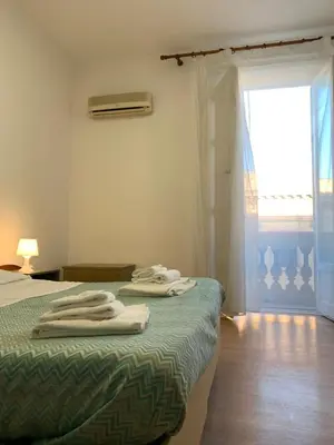 a bedroom with a bed with towels on it at 38 Aira Hotels in Palermo
