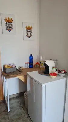 a kitchen with a counter top and a table at Le Terre di Sicilia in Terrasini