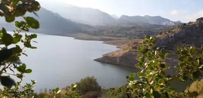 a view of a lake in the mountains at La casa del custode in Caccamo