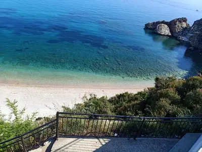 a view of a beach from a balcony at Villa Barone in Castellammare del Golfo