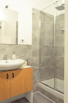 a bathroom with a sink and a shower at Bonorum Santa Sofia in Palermo