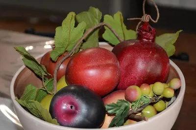 a bowl full of fruits and vegetables on a table at Appartamento Casa Magnolia in San Vito lo Capo