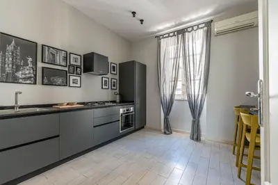 a bedroom with a bed and a window at Dante Design Apartment by Wonderful Italy in Palermo
