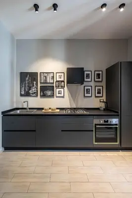 a kitchen with a counter and a sink and a refrigerator at Dante Design Apartment by Wonderful Italy in Palermo
