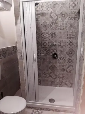 a bathroom with a shower with a toilet at CASA VACANZA DI VIA GIACALONE in Palermo