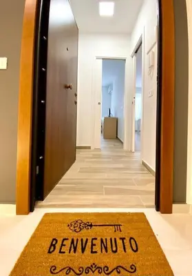 a welcome mat on the floor of a hallway at Un Raggio di Sole al Massimo in Palermo