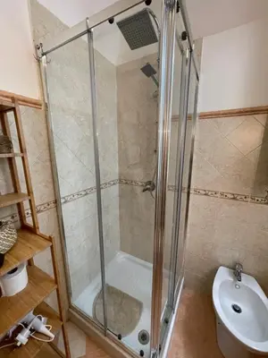 a shower stall in a bathroom with a toilet at Casa vacanze Baglio Barcellona Mondello in Palermo