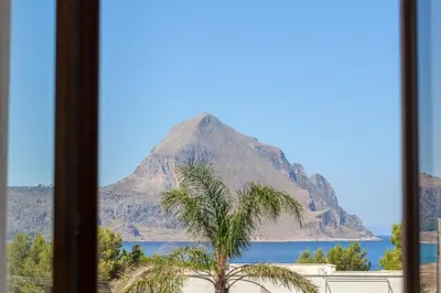 a view of a mountain from a window at LA DAMA in San Vito lo Capo