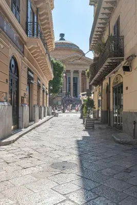 an empty street in a city with a building at Olivella Apartment al Teatro Massimo by Wonderful Italy in Palermo