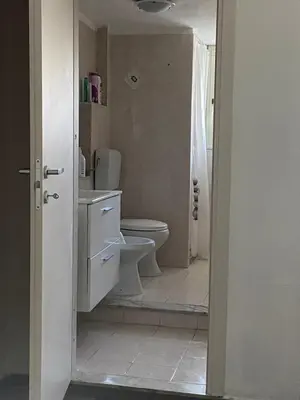 a bathroom with a toilet and a sink at La Casa di Peppe in Capaci