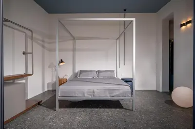 a bedroom with a canopy bed and a window at BED 10.5 - DESIGN SUITE in Castellammare del Golfo