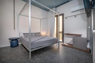 a bathroom with a white sink and a mirror at BED 10.5 - DESIGN SUITE in Castellammare del Golfo