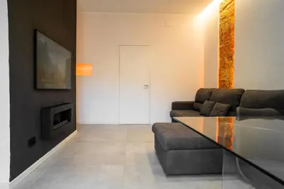 a living room with a couch and a table at Politeama Centre in Palermo
