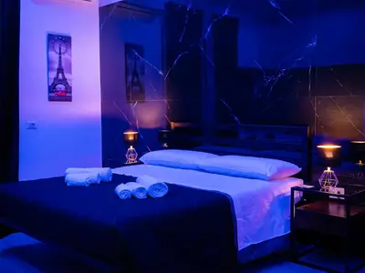 a bedroom with a bed with two towels on it at Aliva suite LT in Palermo
