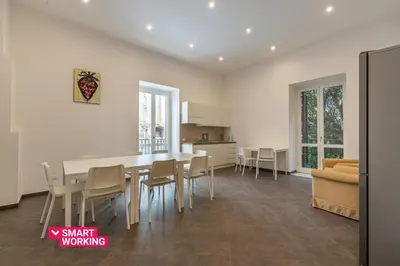 a kitchen and dining room with a table and chairs at Apartments La Cala by Wonderful Italy in Palermo