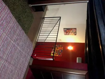 a stairway with a spiral staircase in a building at Kalza House in Palermo