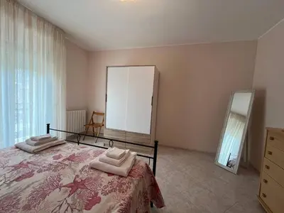 a bedroom with a bed with a mirror and a dresser at Appartamento Gemma D'oro in Castellammare del Golfo